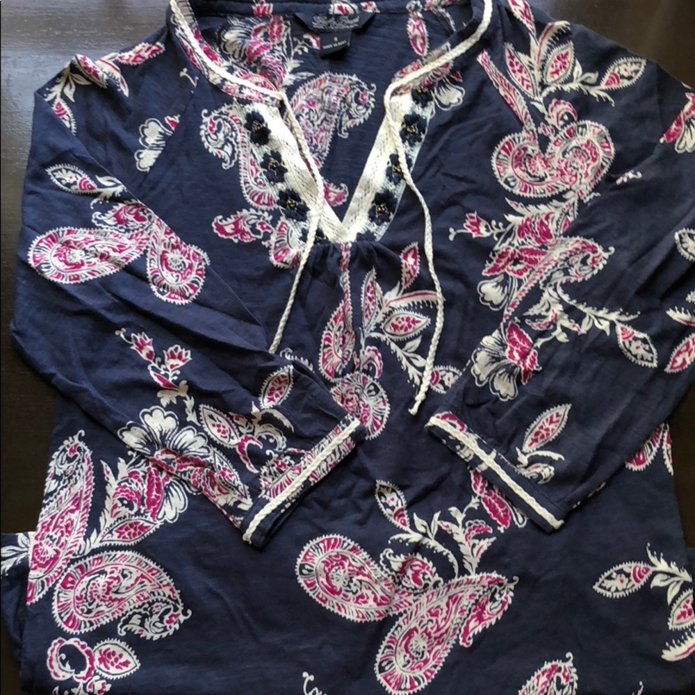 A navy top with floral prints